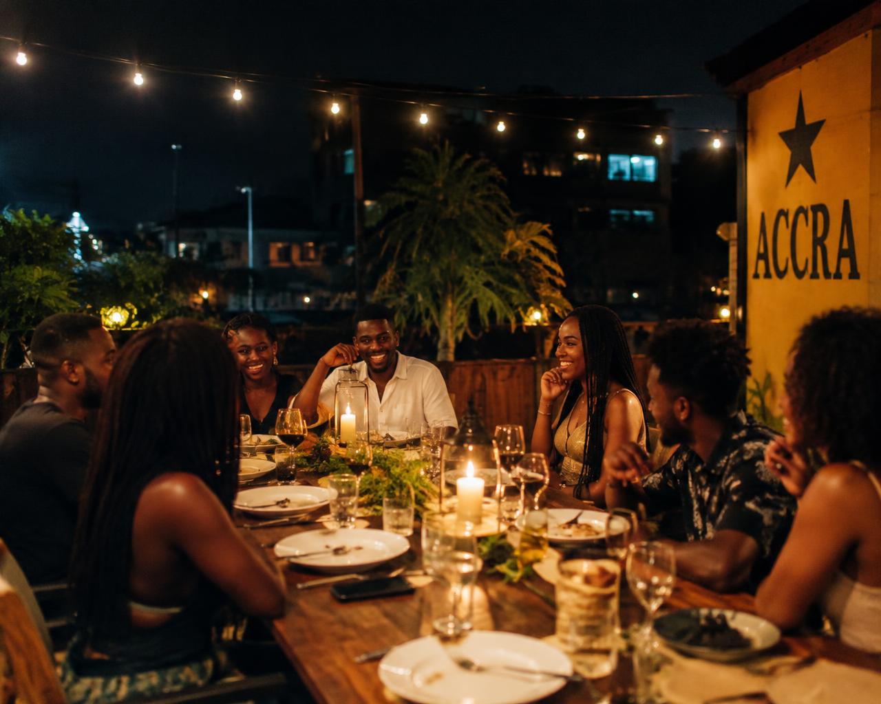 Friends sharing dinner in Accra